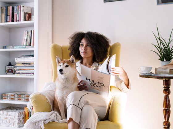 woman sitting in chair with dog