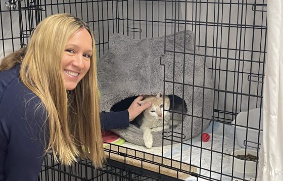 woman with cat in cage